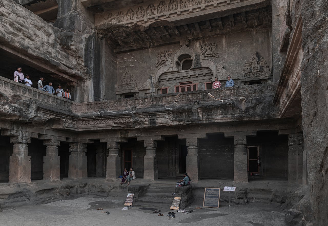 Visitors explore the UNESCO World Heritage Site Ellora Caves in India.